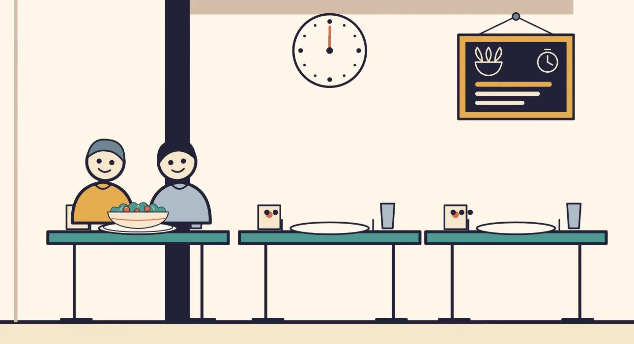 A still from the lesson: two smiling regulars share a salad at a restaurant table, next to empty tables, a clock and a menu board.